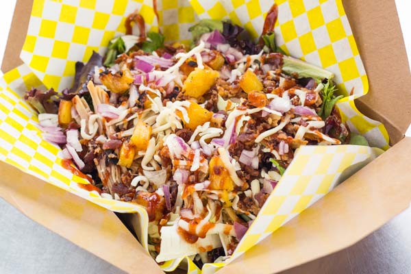 Hawaiian High 5 Salad from Alphabetical with chopped meat, fruit and veggies in a takeaway box.