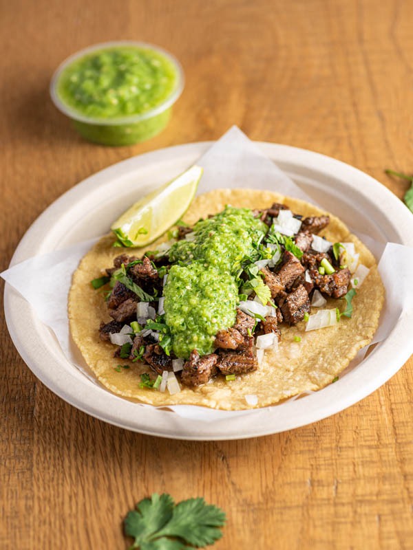 Bird's eye view of taco with guacamole served at Tacos Rudos in Budd Dairy Food Hall, Columbus, Ohio