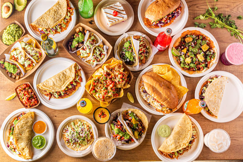 Bird's eye view of array of dishes served at Tacos Rudos in Budd Dairy Food Hall, Columbus, Ohio