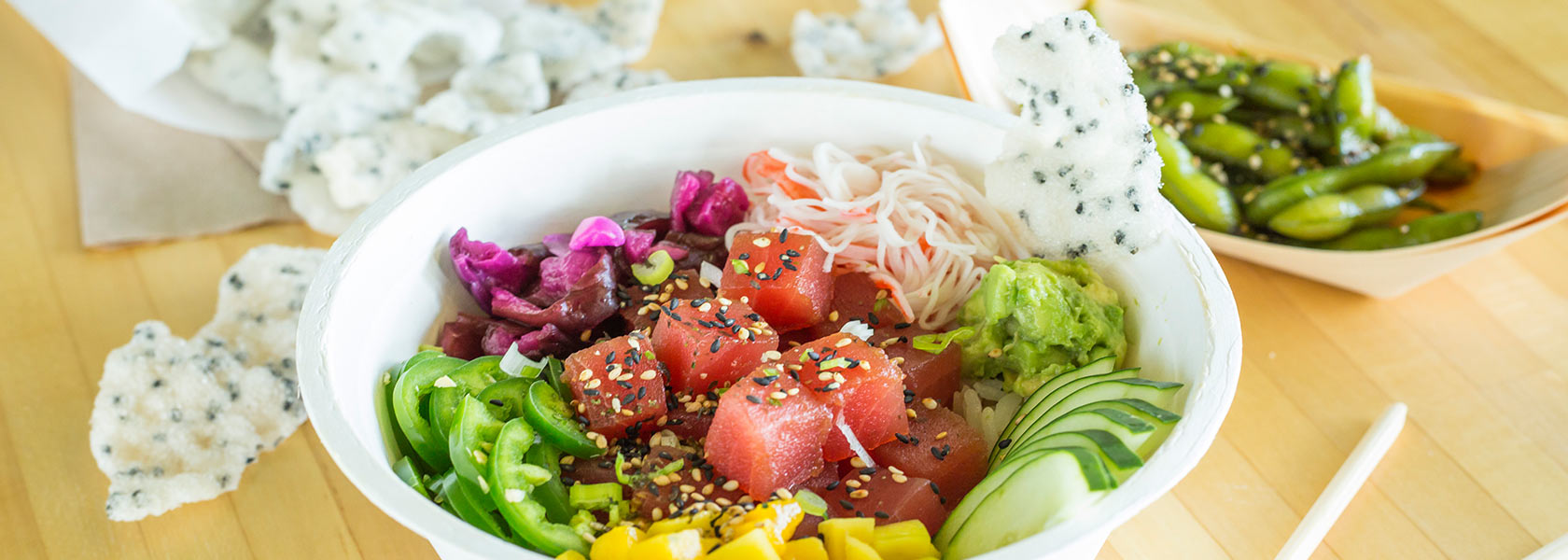 Colorful tuna poke bowl with fresh veggies.