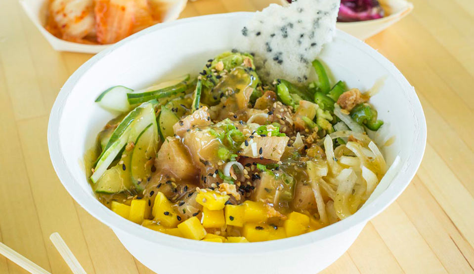 Colorful poke bowl with fresh veggies.