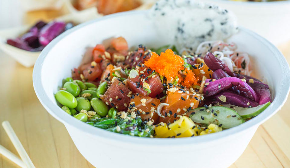 Colorful poke bowl with fresh veggies.