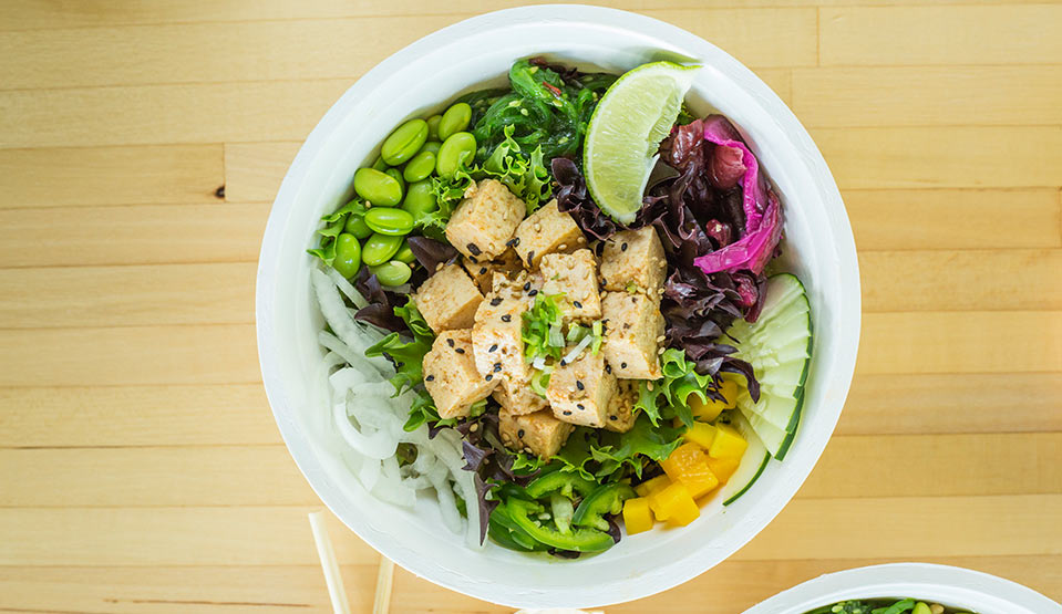 Colorful tofu bowl with fresh veggies.