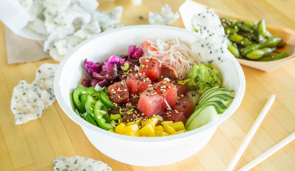 Colorful tuna poke bowl with fresh veggies.
