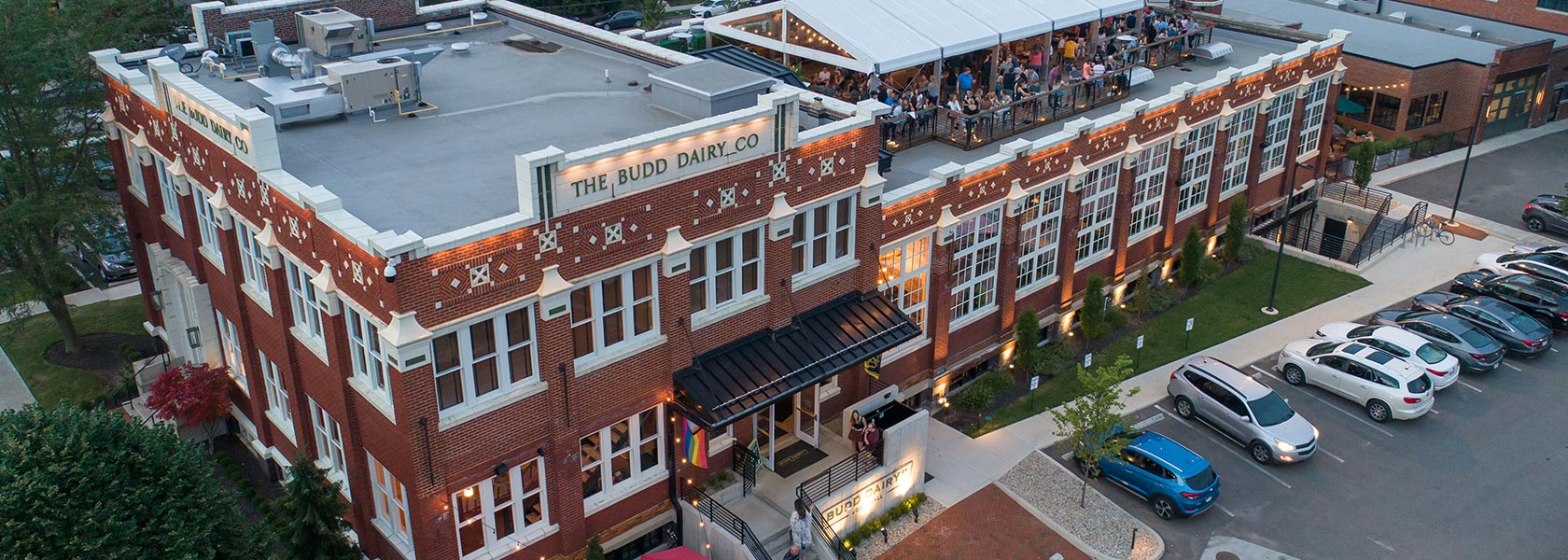 Aerial view of Budd Dairy Food Hall with rooftop gathering.