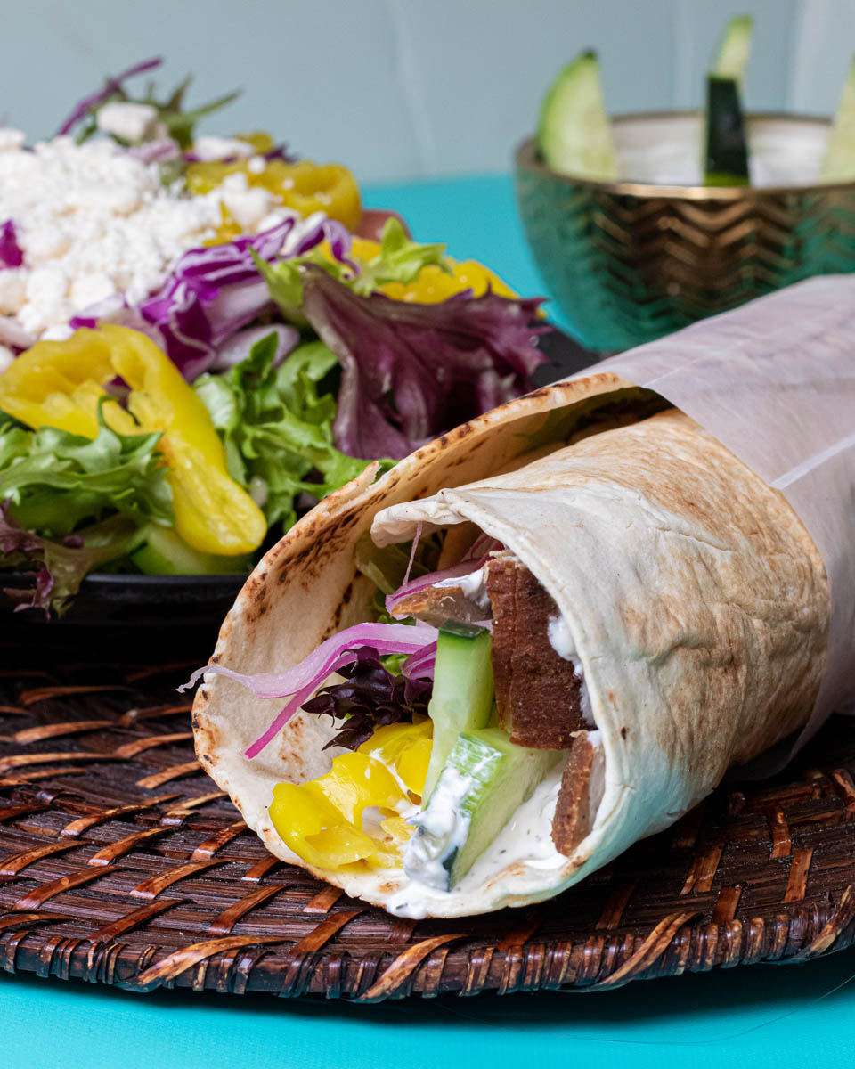 Pita wrap and salad served by Zaki Mediterranean Grill at Budd Dairy Food Hall