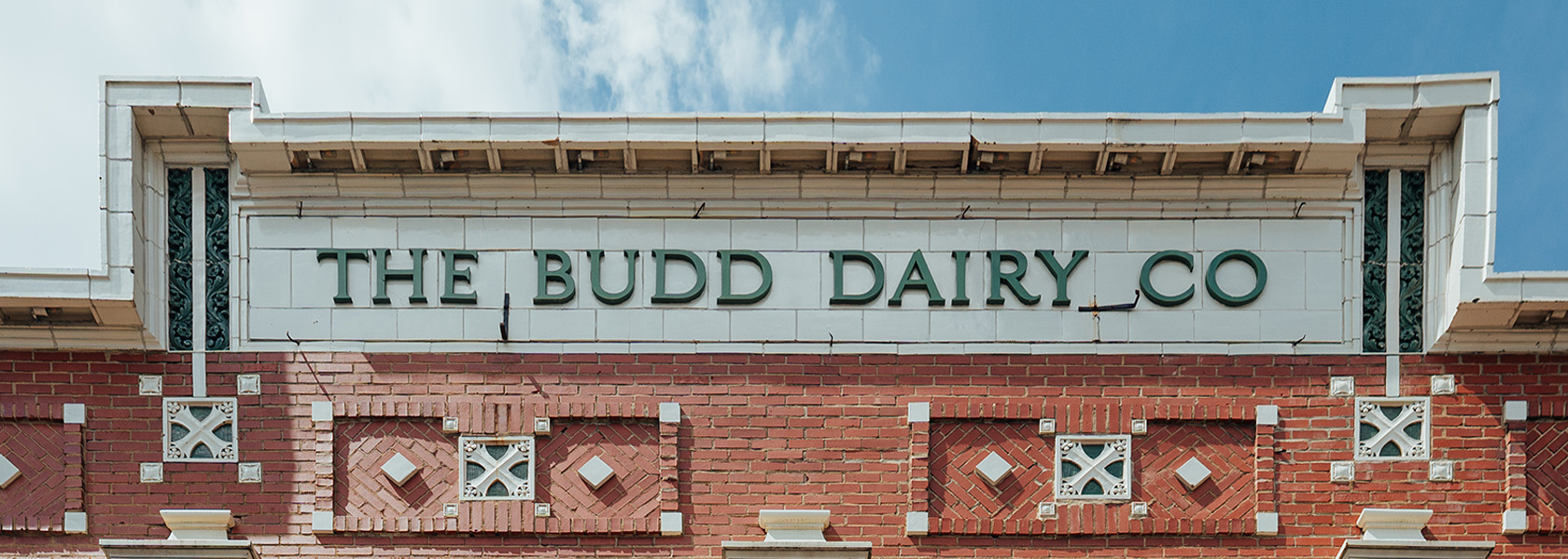 Close up of the Budd Dairy Food Hall sign on the exterior of the building