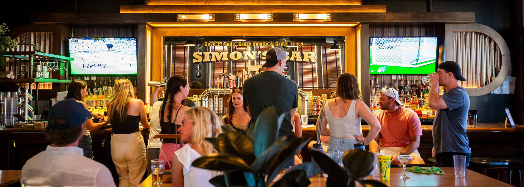 A group of people relaxing in Simon's Bar at Budd Dairy Food Hall in Columbus, Ohio.