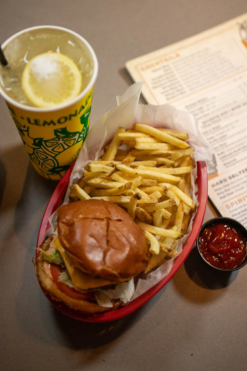 Basket with burger and fries with lemon shake-up drink served at Burger Royale at Budd Dairy Food Hall in Columbus, Ohio.